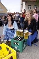 Steins of Helles bier or German light beer are served during the Maibaumfest in Putzbrunn, Germany.