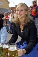 The ladies served up German light beer to the working men during the Maibaumfest in Putzbrunn, Germany.