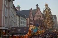 Crowds of people fill the Romerplatz outside the Romer or Town Hall in Frankfurt in Hessen, Germany while the Christmas Markets are open.