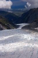 The 13 kilometre long Fox Glacier carves out a glacial path through the mountainous landscape of Westland National Park on the South Island of New Zealand.