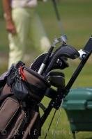 The golf bag and clubs are ready for the player to choose the next club while contemplating his shot at the Oliva Nova Golf Course on the Costa Blanca in Valencia, Spain.