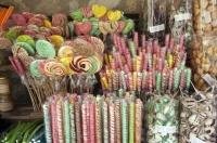 Colorful candy displayed in the window of a store in the village of Gourdon of the Provence, France in Europe.