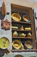 Unique french pottery adorns the outdoor shelves of store in the village of Gourdon, Alpes Maritimes, Provence, France.