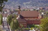 A large and imposing church stands out in the cityscape in the city of Innsbruck in Tirol, Austria, Europe.