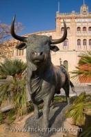 An intimidating statue of a bull stands outside the Plaza de Toros bullfighting arena in the town of El Puerto de Santa Maria in Andalusia, Spain.