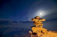 Cold arctic winter scene with a Inukshuk