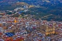 As dusk starts to move in over the city of Jaen in Andalucia, Spain, the streets and buildings will start to illuminate the area.