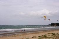 Many people who visit Orewa beach on the North Island of New Zealand, find kiteboarding the ideal way to spend their holiday.