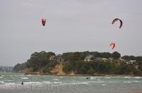 The winds along Orewa Beach on the North Island of New Zealand are ideal for kitesurfing.