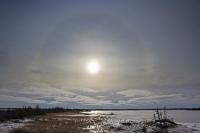 A halo around the sun forms over Lake Iwago in the Churchill Wildlife Management Area in Churchill, Manitoba in Canada.