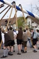 Men wearing traditional lederhosen at the Maibaumfest in Putzbrunn, Germany.