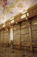 Wooden shelves of historic books fill up the walls of the library at the Stift Melk in Austria, Europe.