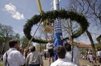 The wreath is suspended near the base of the Maibaum in the town of Putzbrunn, Bavaria, Germany.