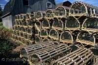 Lobster traps are lined up by the boat houses ready for a day of trapping in Malpeque in Prince Edward Island, Canada.
