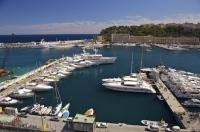 Luxury yachts line the docks of Monte Carlo, Port de Monaco along the Cote d'Azur, Corniches de la Riviera.