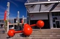 A bright red scientific creation on exhibit outside of the Montreal Science Centre in Old Montreal in Quebec, Canada.