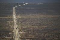 The long straight road of Highway 163 in Monument Valley, Utah, USA.