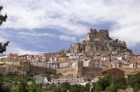 This photo was taken below the village of Morella in Valencia, Spain where closely knit houses stand around the base of the Castillo de Morella.