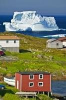 Stock Pictures of Newfoundland showing an Iceberg and a stage used for storing fishing nets and supplies along the French Shore at St Julien's.