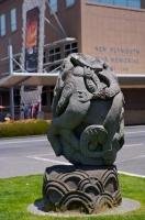 A Nga Hau e Wha stone statue displayed outside of the New Plymouth War Memorial building in Taranaki, New Zealand.