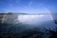 A beautiful rainbow forms on the Horseshoe Falls in the popular vacation destination of Niagara in Ontario, Canada.