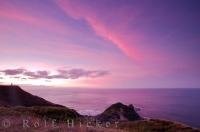 Vibrant colours of pink, purple and blue rule the sky during sunset over Cape Reinga in Northland on the North Island of New Zealand.
