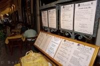 Menus adorn the wall of an Old Town Street Cafe in Nice, Provence in France, Europe.