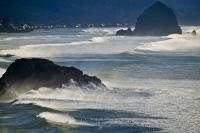 The coastal community of Cannon Beach guarded by Haystack Rock in Ecola State Park in the state of Oregon, USA.
