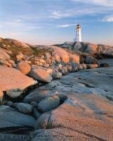 Peggy's Cove Lighthouse in Nova Scotia at sunset