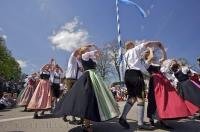 A group of people dancing during the Maibaumfest in Putzbrunn, Germany.