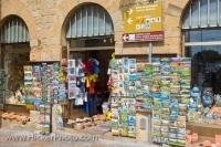 These busy shop windows in the city of Volterra in Tuscany, Italy display souvenirs of the area.