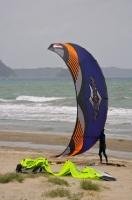 A man prepares his power kite for his day of excitement on the beach in Orewa, just north of Auckland on the North Island of New Zeland.