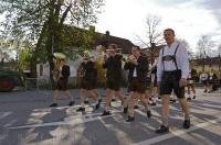 A procession leads the Maibaum into the town centre of Putzbrunn, Germany.