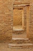 A series of doorways provide access through the thick walls of Pueblo Bonito at the Chaco Culture National Historic Park in New Mexico.
