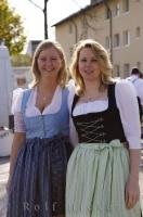 Two ladies pose in their dirndls in the town of Putzbrunn, Germany.