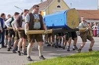 A group of men carrying the Maibaum in keeping with traditions in the town of Putzbrunn, Germany.