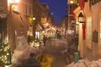 Residents do some Christmas shopping in the quaint stores of the beautifully lit streets in Quebec City, Canada.