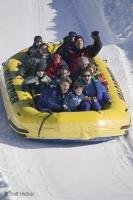 Snow rafting at the Quebec Winter Carnival is a joyous event for the whole family.