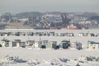 Fishing shanties on the St Lawrence River in Quebec, Canada.