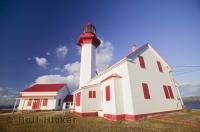 The brightly coloured lighthouse of Metis sur Mer is situated on the South Shore of the St Lawrence River in Quebec on the Gaspe Peninsula.