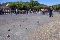 An massive outdoor competition in the village of Quillan, France in Europe known as a game called petanque.