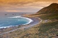 An amazing sunset over Rocky Point on the North Island of New Zealand.