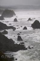 Rocks jut out along the rugged coast of California in the USA.