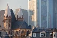 The historic church of Saint Leonards is a well preserved Catholic Church dwarfed by the tall modern buildings in the downtown area of Frankfurt, Germany.