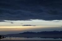 Heavy clouds above Great Salt Lake during sunset in Utah, USA make a beautiful picture.