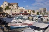 The waterfront and marina in the village of Sausset Les Pins in France is surrounded by great restaurants.