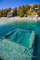 The shipwreck of the ship Sweepstakes, which was built in 1867, lies at the bottom of the Big Tub Harbour in Fathom Five National Marine Park, part of Lake Huron in Ontario. The ship is also known by the name of Sweeps.