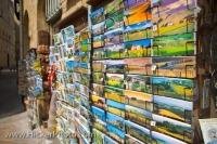 Colourful postcards and other trinkets are sold at souvenir shops like this one throughout the city of Volterra, which is located in the province of Pisa, in the beautiful Tuscany Region of Italy.