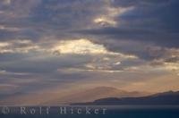 A dramatic gathering of clouds over South Bay makes for an interesting sunset picture in the South Island of New Zealand location. South Bay is situated along the Kaikoura Coast of New Zealand.