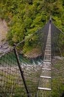 Cross over the Waiohine River on this suspension bridge to Tararua Forest Park on the North Island of New Zealand.